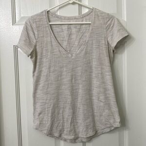 Lululemon grey/off white top. Guessing size is 4-6 range.